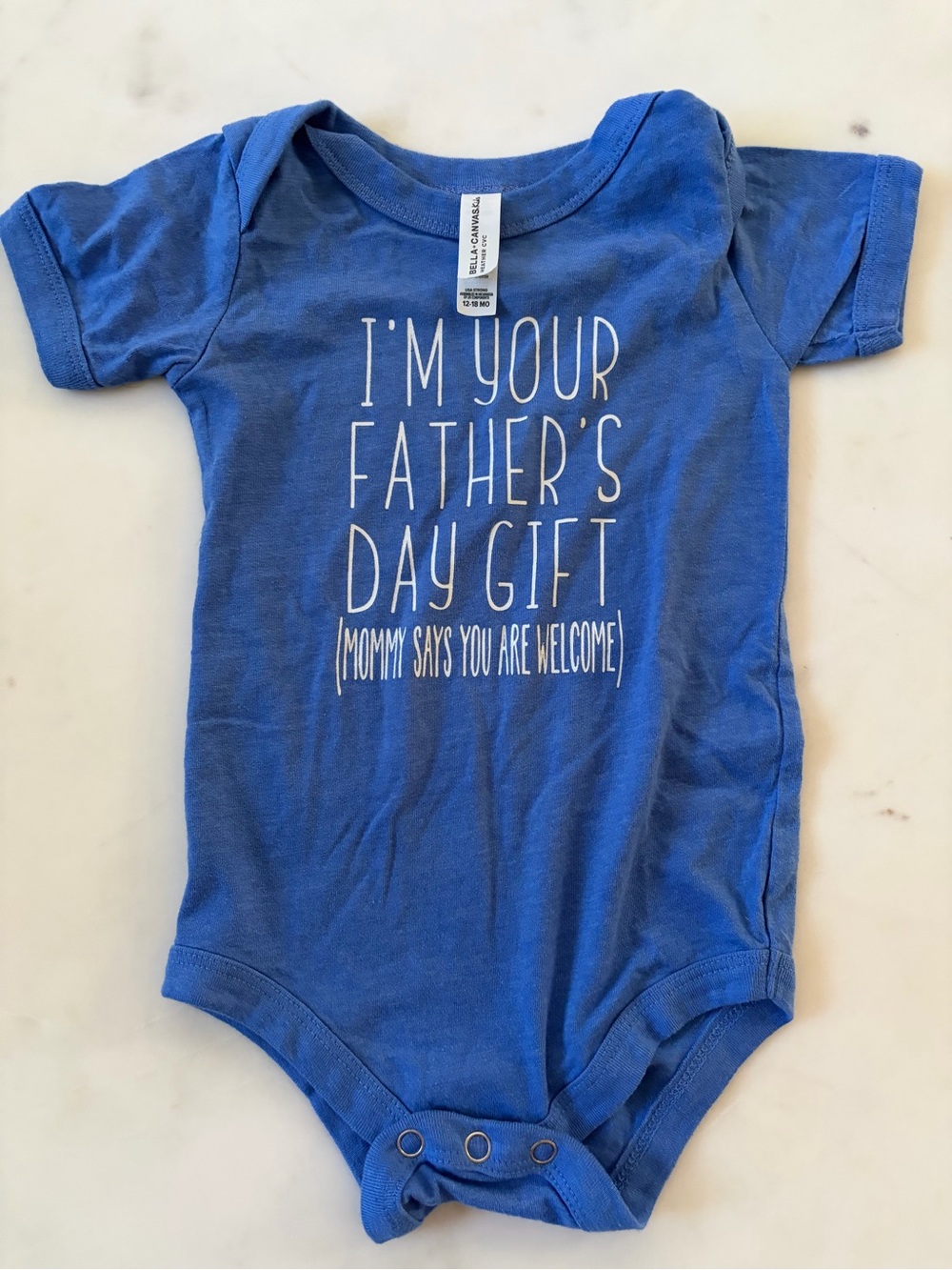 Bella Canvas Blue Baby One-Piece Bodysuit with White Lettering